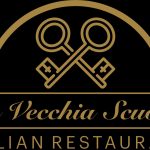 Logo of La Vecchia Scuola Italian Restaurant featuring crossed gold keys on a black background, elegant and classic design