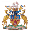 Coat of arms featuring a lamb atop a helmet, flanked by two leopards, symbolising heritage and tradition in heraldry