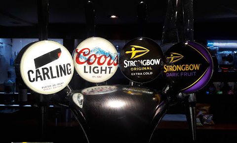 Bar taps with brands: Carling, Coors Light, Strongbow Original, Strongbow Extra Cold, and Strongbow Dark Fruit.