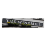 Sign for The Windmill pub with decorative yellow flowers in a wall-mounted planter, black and white colour scheme